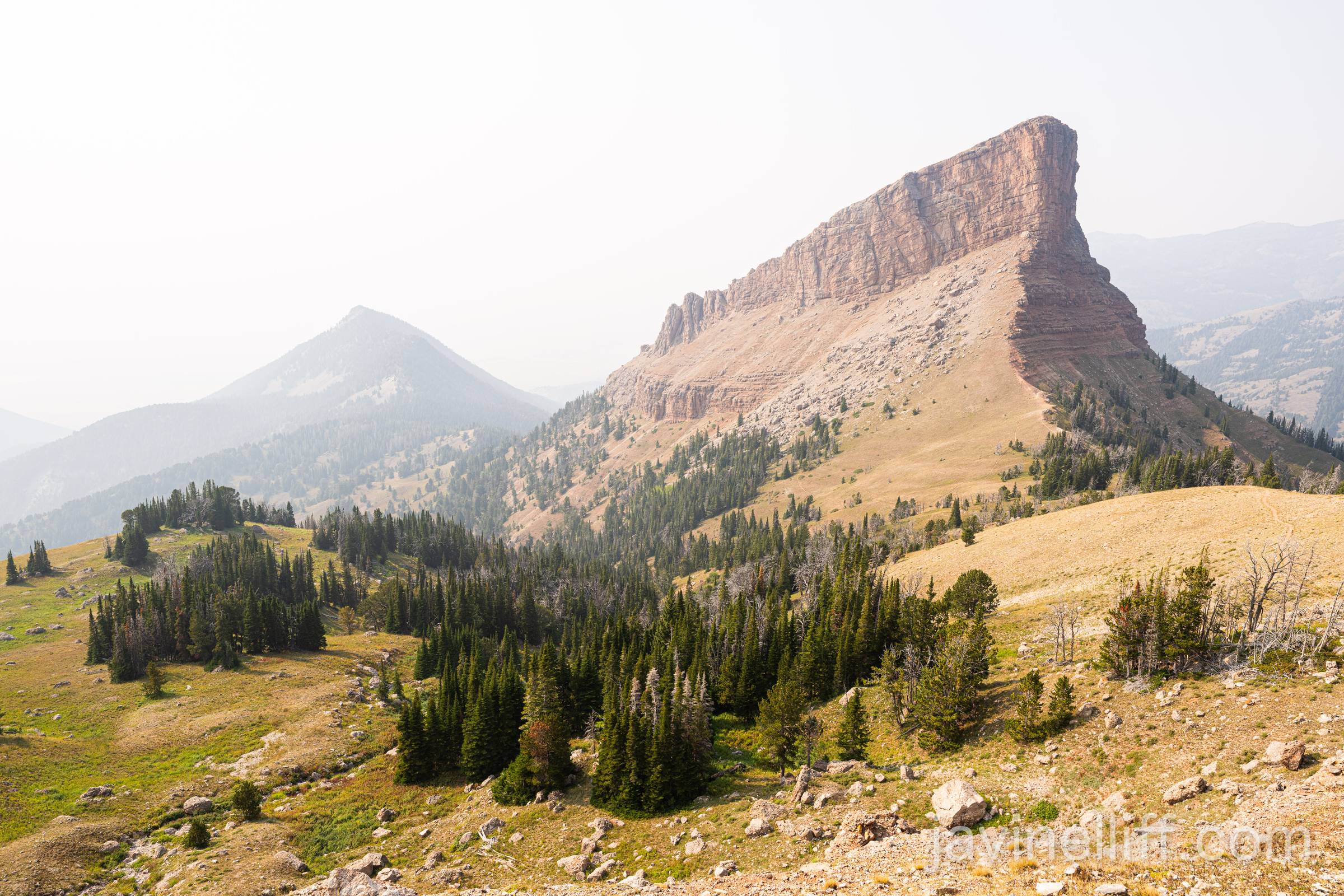 Hazy Rockies A unique rock formation in the Rocky Mountains on a smoky day.